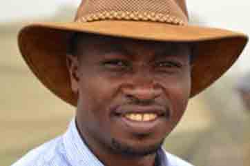 A man wearing a hat and shirt.