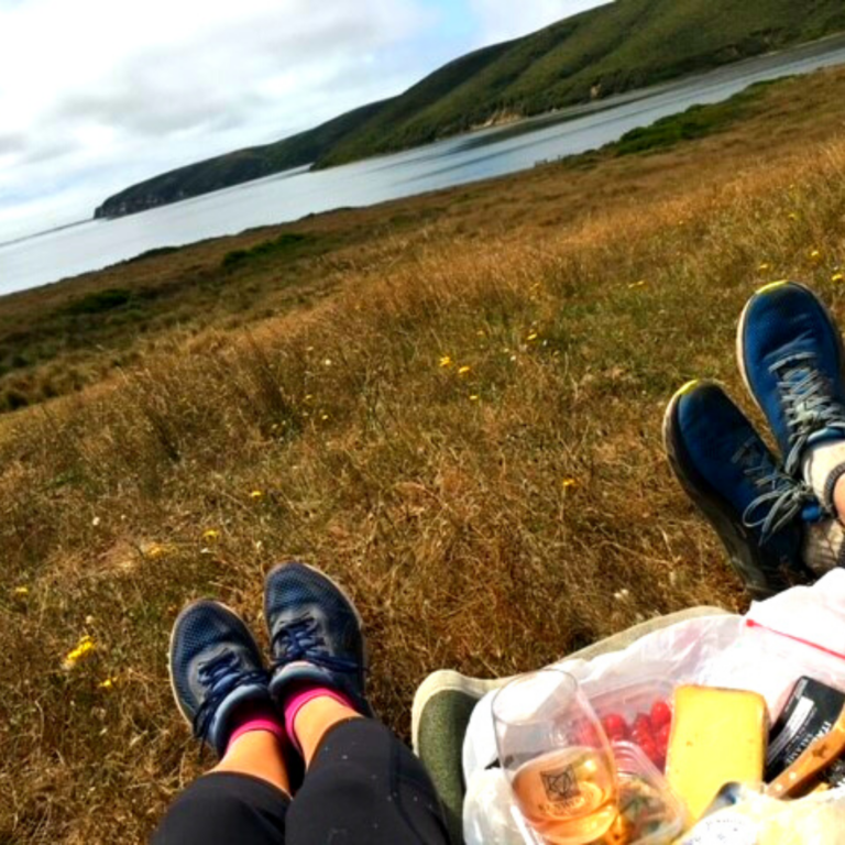 hiking boots at a hiking spot near the mountains  hiking with mountain views with gear