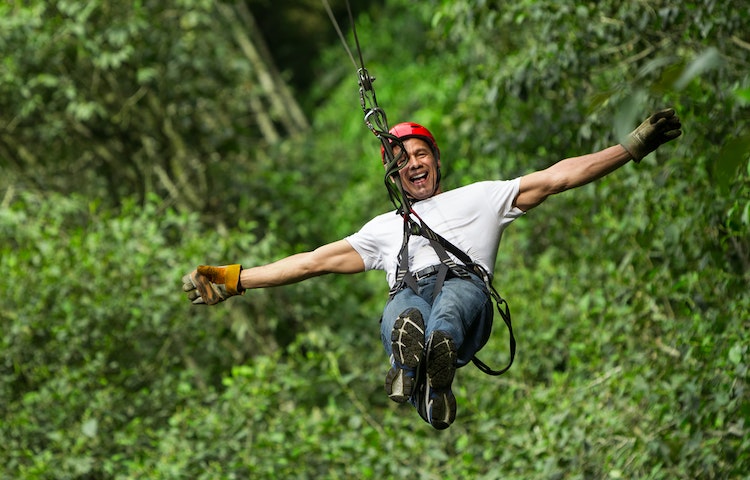 man on a flying swing