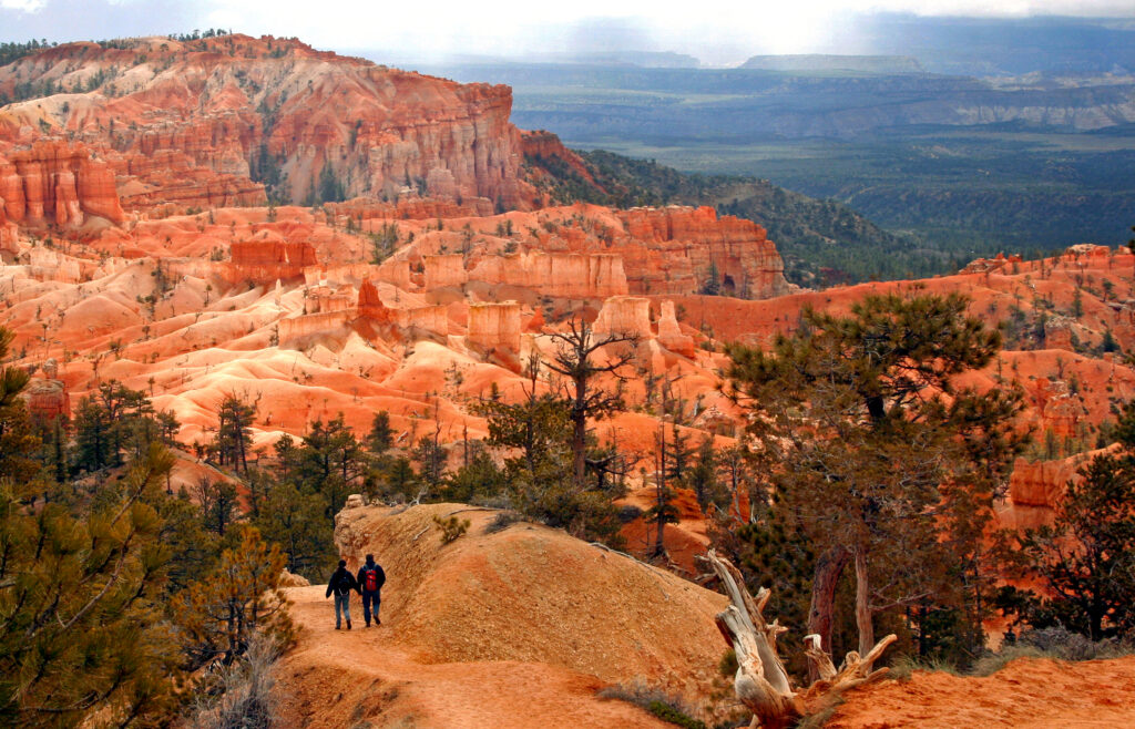hikers head down a trail to the interior of Bryce Canyon National Park in southwestern Utah