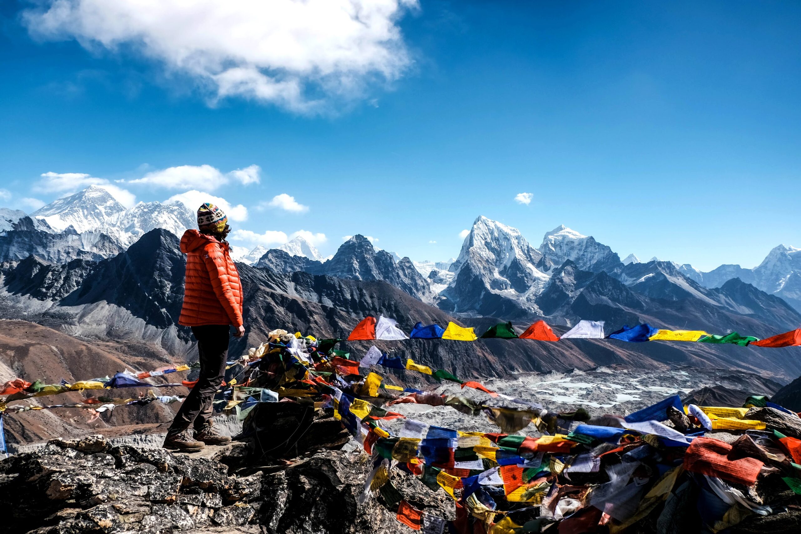 Woman standing on top of Gokyo Ri with view on Mt. Everest, Himalayas, Nepal