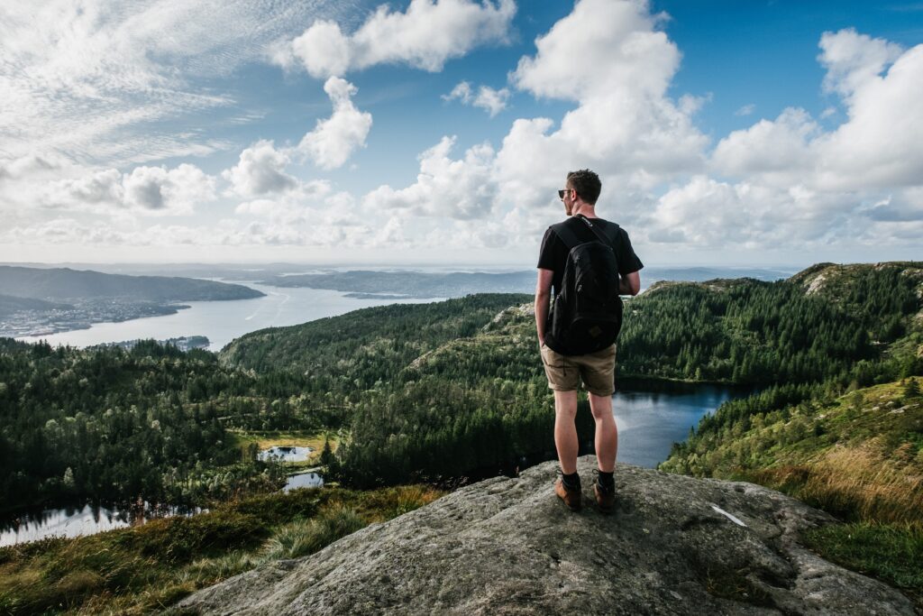 man hiking with an athletic daypack on a multi day hiking trip 