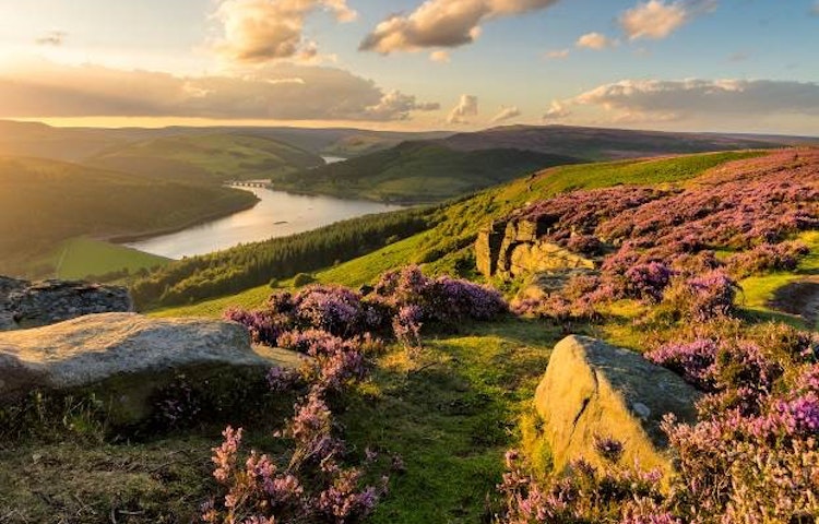 Tourists in a coast to coast path that explores the lakes, moors, and dales