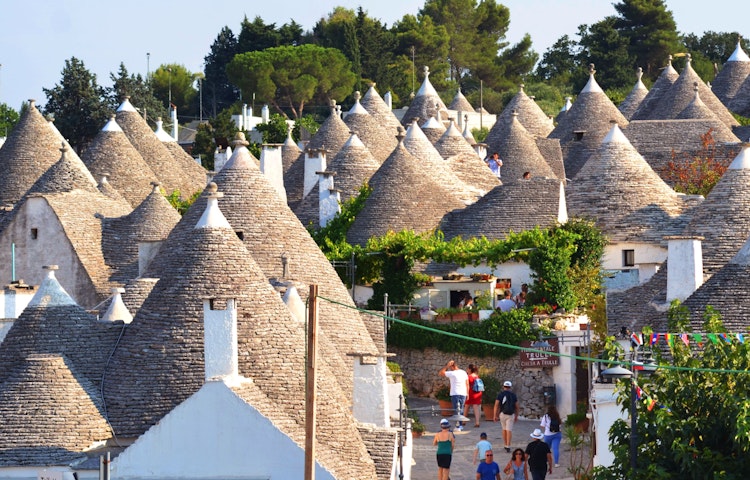 Explore ancient port cities and hike hidden trails through olive groves, canyons, and grottos on this Puglia 8-day adventure! | Shutterstock.com