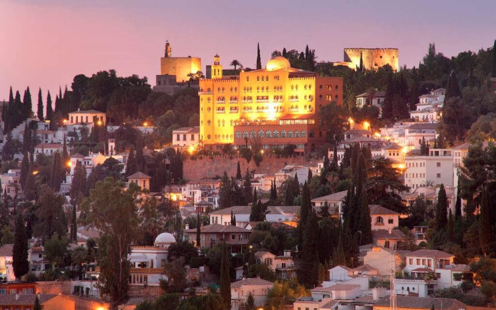 A scenic night view of Alhambra Palace in Granada - that is stylish and Moroccan-inspired