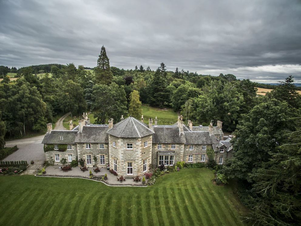 An aerial view of the amazing Coul House in Scotland, that is a perfect overnight stay exploring the Scottish Highlands