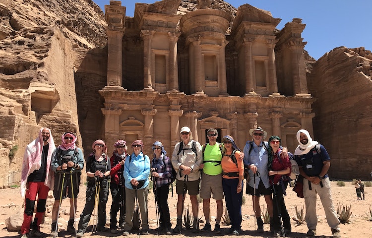 group of travelers on guided cultural discovery immersion in UNESCO-designated Petra in the Jordan in Middle East