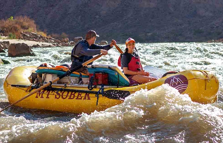 girl smiling joyously from cataract canyonlands rafting multi-day trip