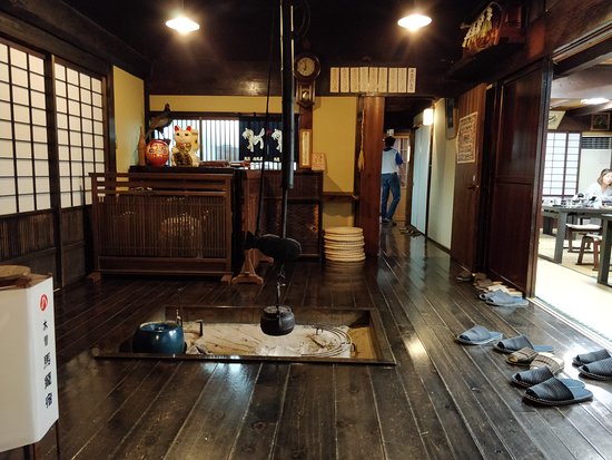 A japanese house with a wooden floor.