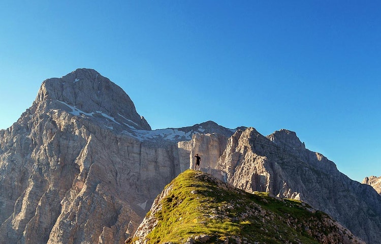 solo male traveler at the top of the Dinaric Alps in the Balkans in Europe