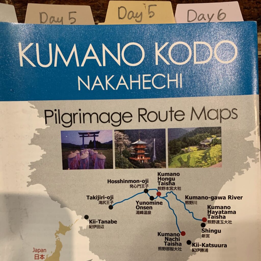 Local Guide Showing Travelers a Map of the Kumano Kodo Pilgrimage Route