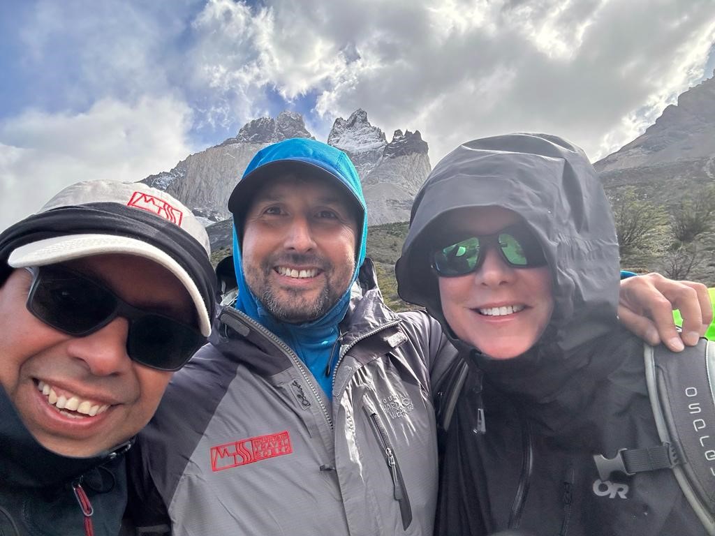 Photo of our Patagonia mountain hiking guide expert Ro and two other passengers on a Patagonia hike