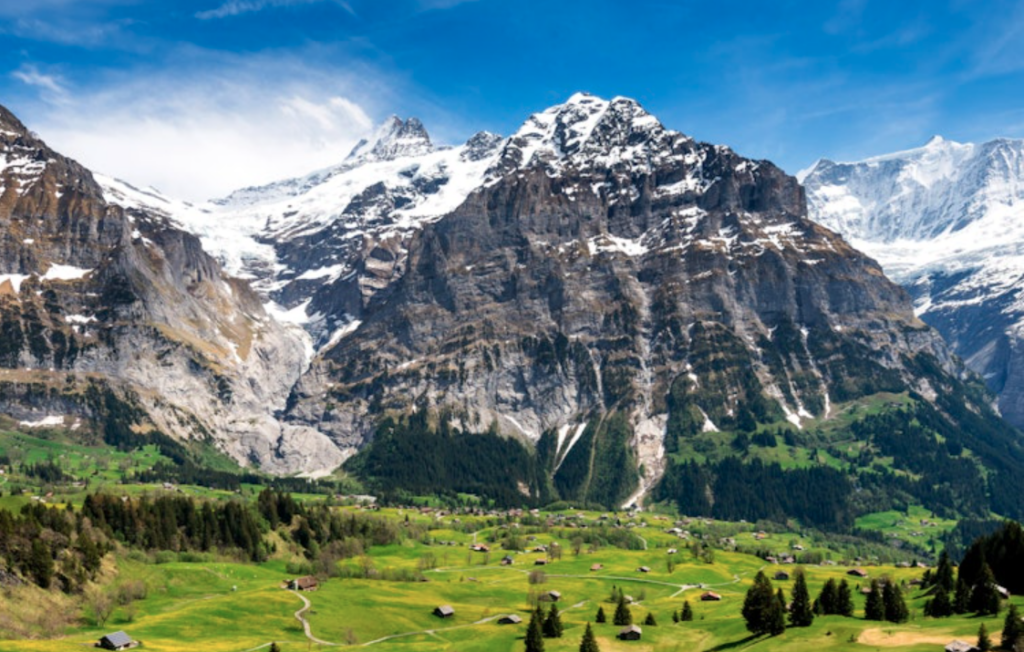 Panoramic view of the green mountain town of Grindelwald, which has an open view of the northern face of the Eiger