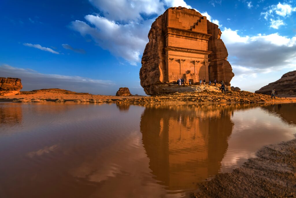 Tourists exploring the madain saleh or al hijr which is an archaeological site located in alula in saudi arabia