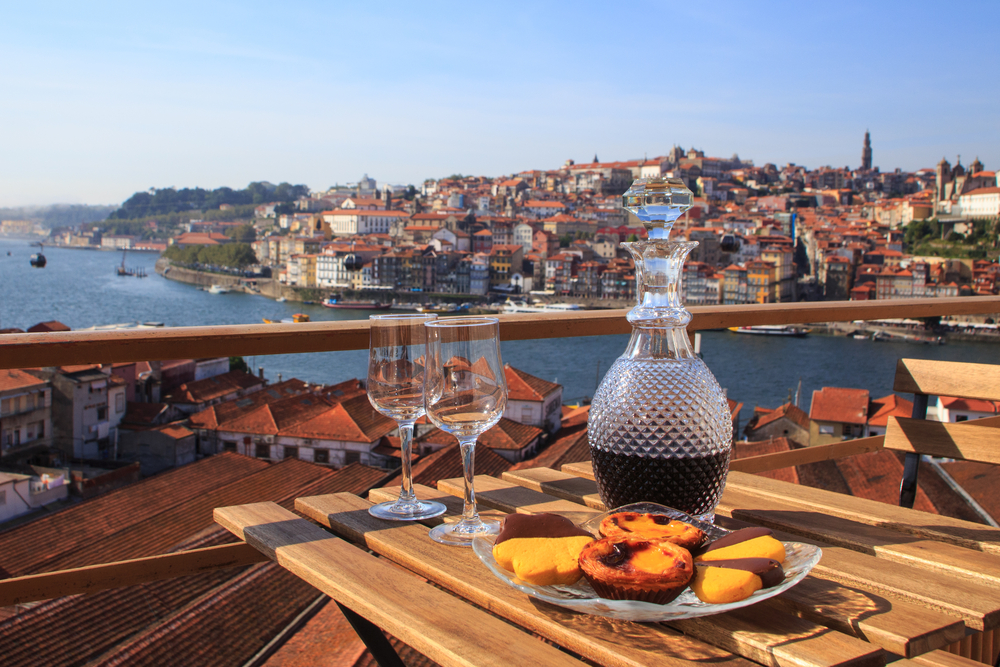 A wooden table on a balcony in Oporto, Portugal's foodie capital during a guided tour