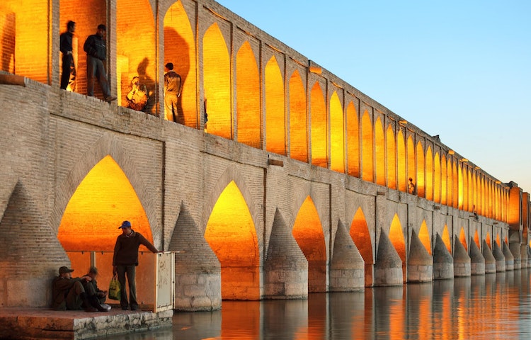 Tourists exploring a beautiful historic site on a cultural discovery tour in Iran