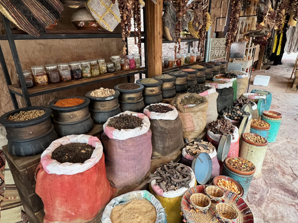 Tourists buying aromatic spices at the local traditional souks in Saudi Arabia