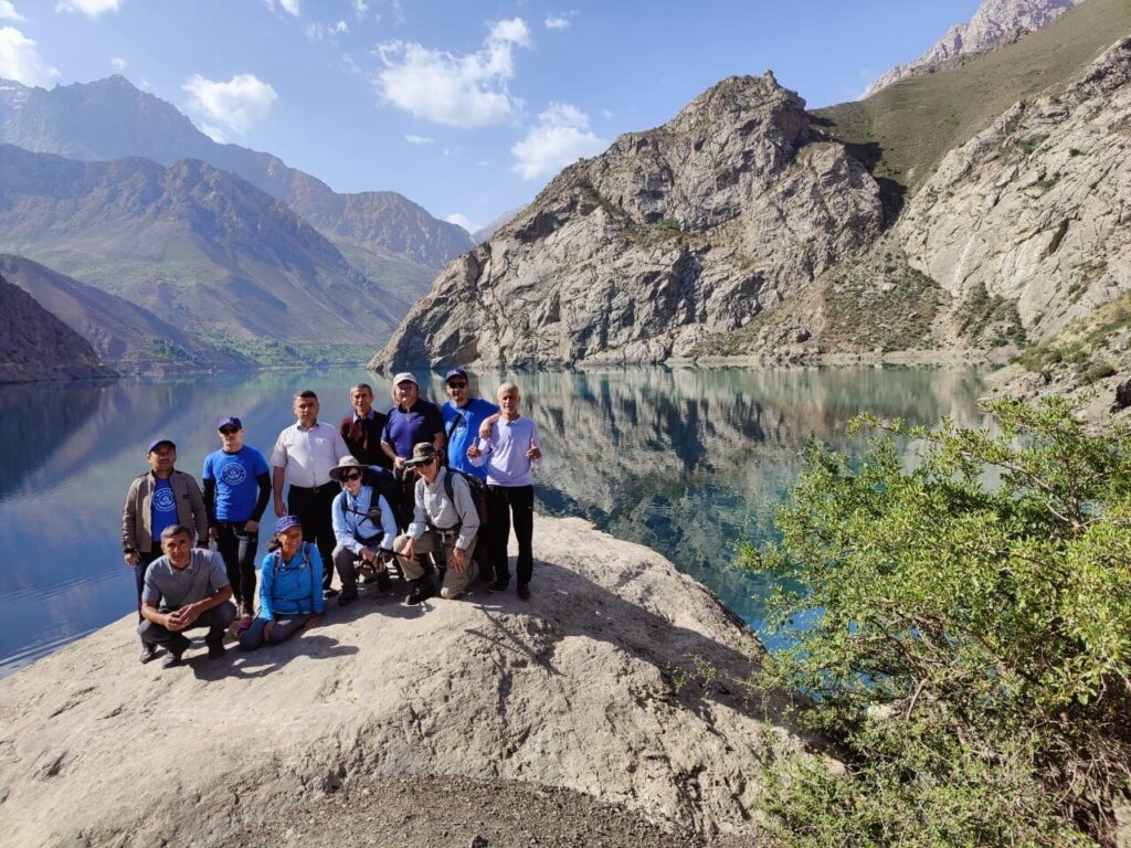 Group of hikers hiking the great Tajikistan Fann Mountains in Tajikistan