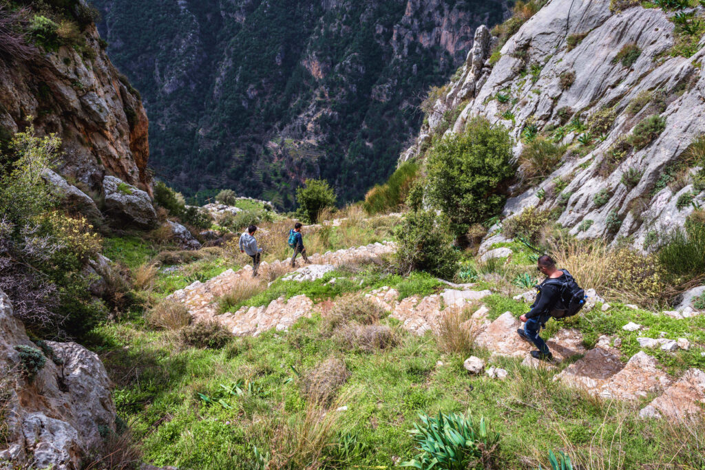 Tourist on a stairs from Hawka village to Kadisha Valley also called Holy Valley in North Governorate of Lebanon