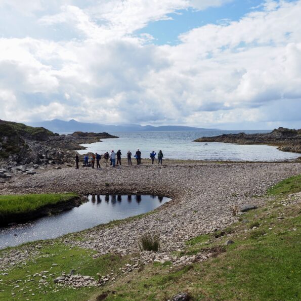 Tourists hiking the Isle of Barra, one of the Scottish Islands in Europe