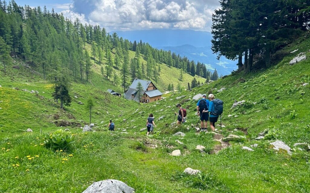 group of hikers trekking the scenic great Highlands in Slovenia, near Julian Alps, in Europe