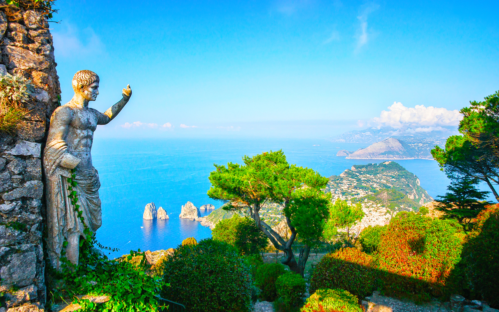 Statue at garden on Capri Town in Italy, Europe with Amalfi coastline as backdrop