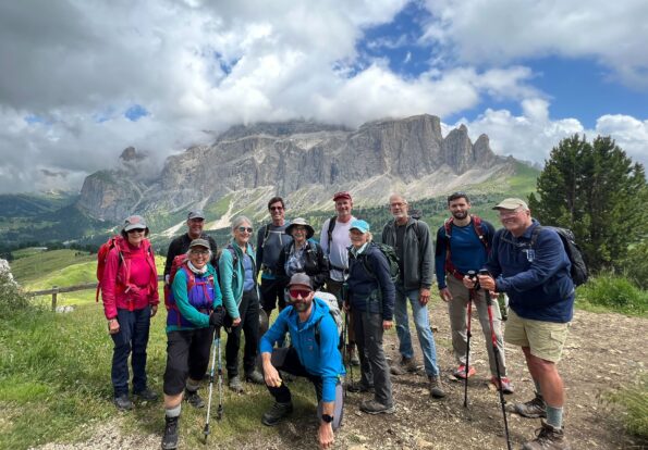 Group of trekkers on a guided challenging trek at the Dolomites in the Alps region in Italy, Europe