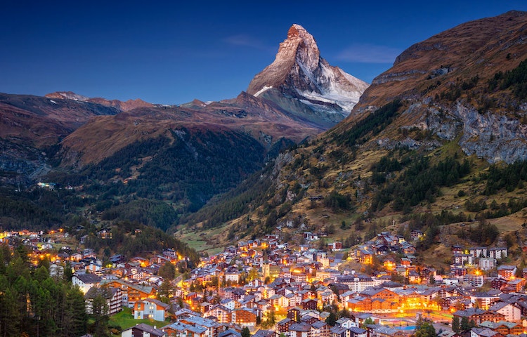 Zermatt, Switzerland at dusk with the matterhorn mountain in the background