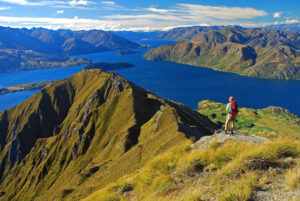 Solo hiker on the Wanaka Lake trail in New Zealand, Europe