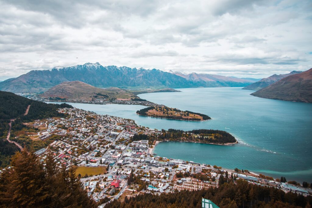 aerial view of all of Queenstown, New Zealand, surrounded by the Southern Alps