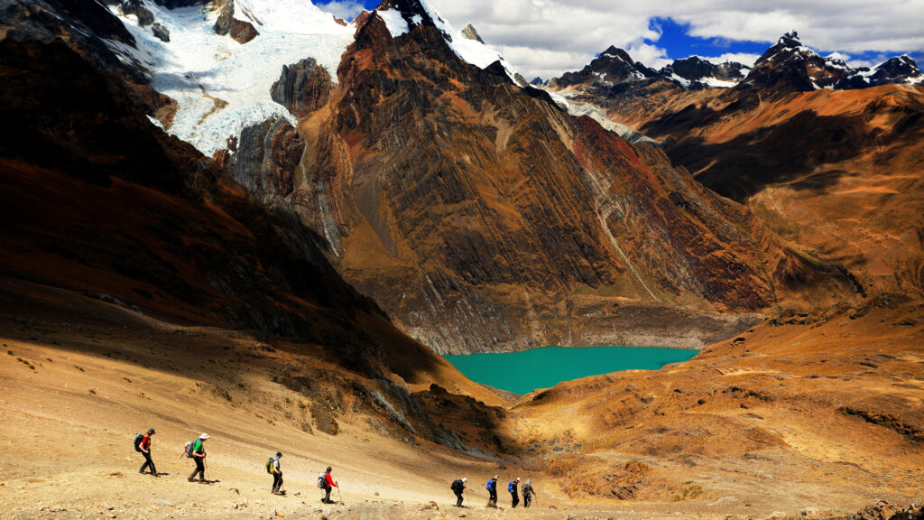 group of trekkers hiking Cordillera Huayhuash in Peru, South America