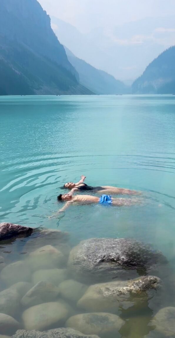two male and female travelers floating in the Canadian Rockies on a custom adventure in North America