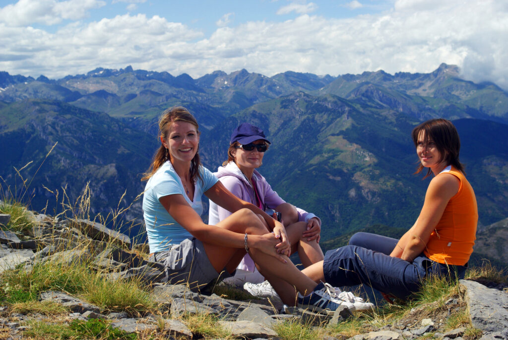 group of female friends hiking famous trails in Italy's Gran Paradiso National Park in Europe
