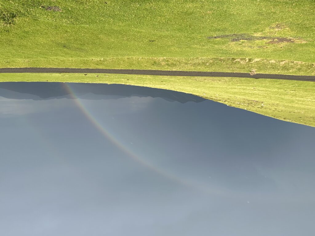 seeing a big rainbow in the middle of a pilgrimage in the Camino de Santiago trail in Spain, Europe