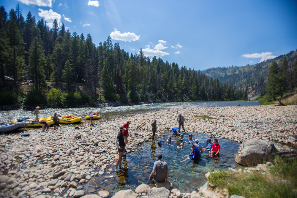 dipping feet in water of Middle Fork of the Salmon River in Idaho, North America, in the summer