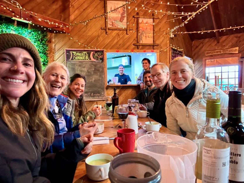 Celebrating with wine and snacks after a successful hike in Patagonia with group