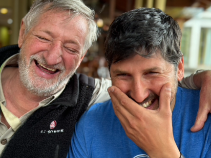 Claudio laughing while donning the MT Sobek logo on his jacket