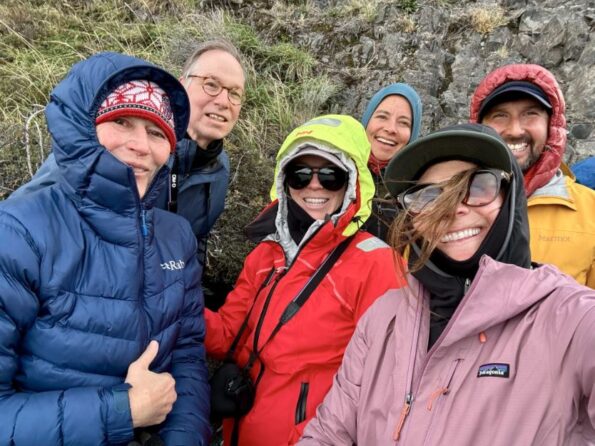 With group of travelers in Patagonia in autumn with hiking assistant