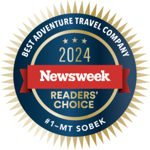A circular blue and gold emblem with "Newsweek" in the center, recognizes "#1 - MT Sobek" as the "Best Adventure Travel Company" in the "2024 Readers' Choice" awards.