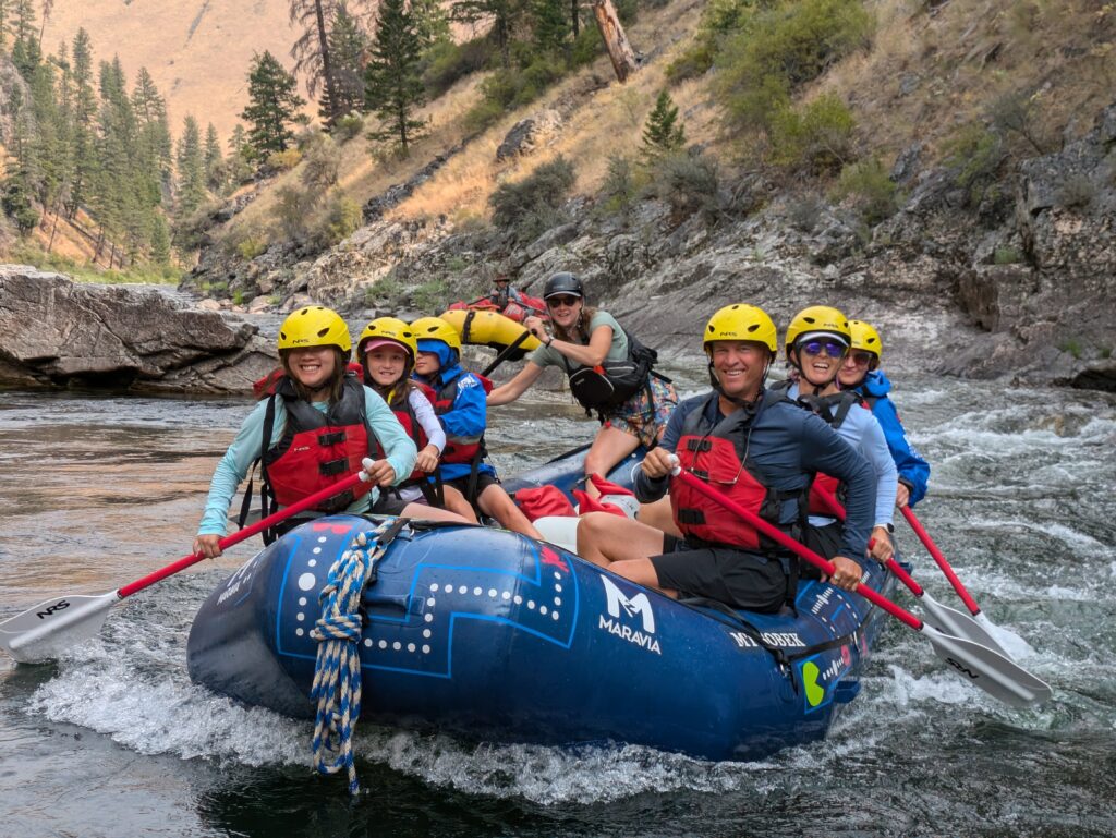 hitting the whitewater rapids during paddle boat to downstream in Idaho Middle Fork