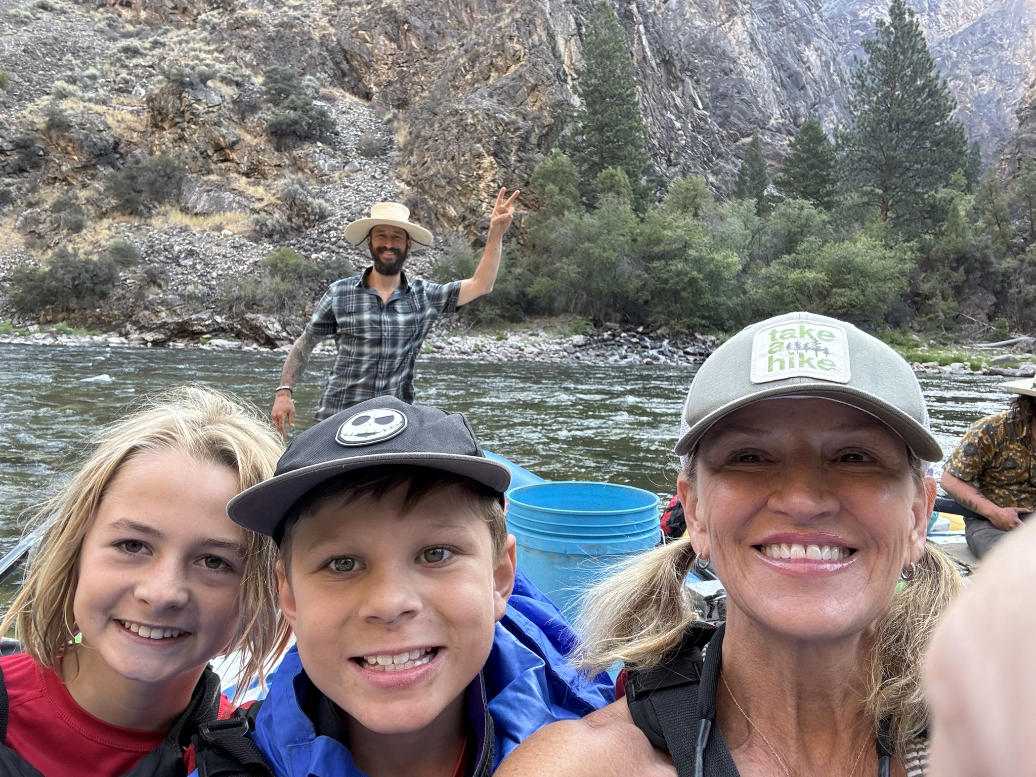 happy guests with Paul Britt in the back in Idaho river rafting trip in Middle Fork