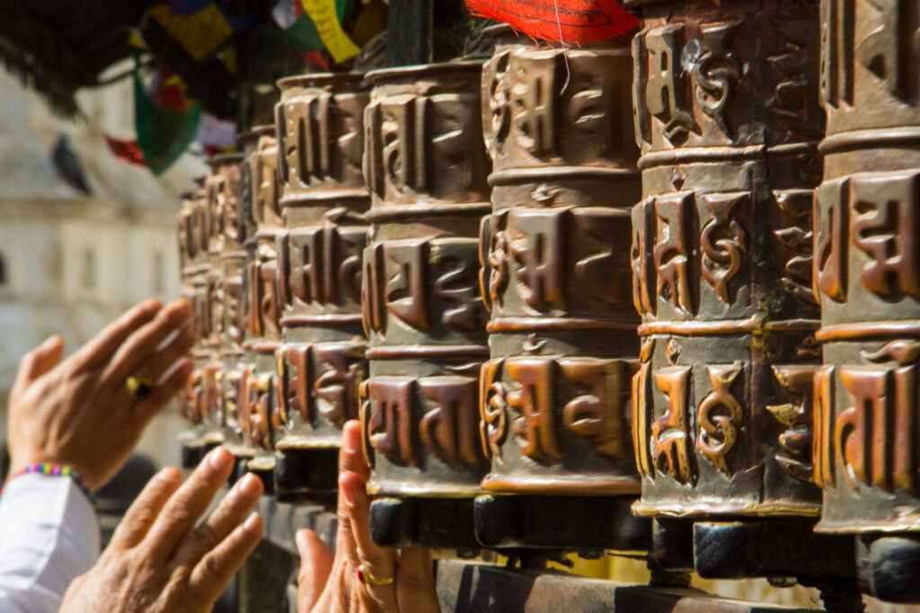 spin one of the many prayer wheels in Kathmandu Valley in Nepal - a must-see UNESCO site