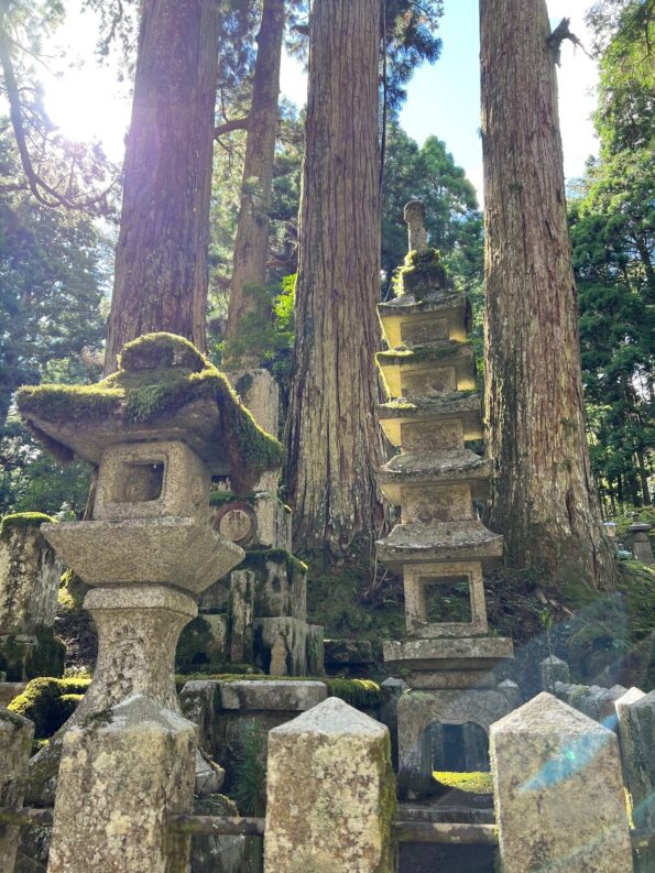 gravestones in ancient Nakasendo trail in Kyoto to Tokyo hiking trip