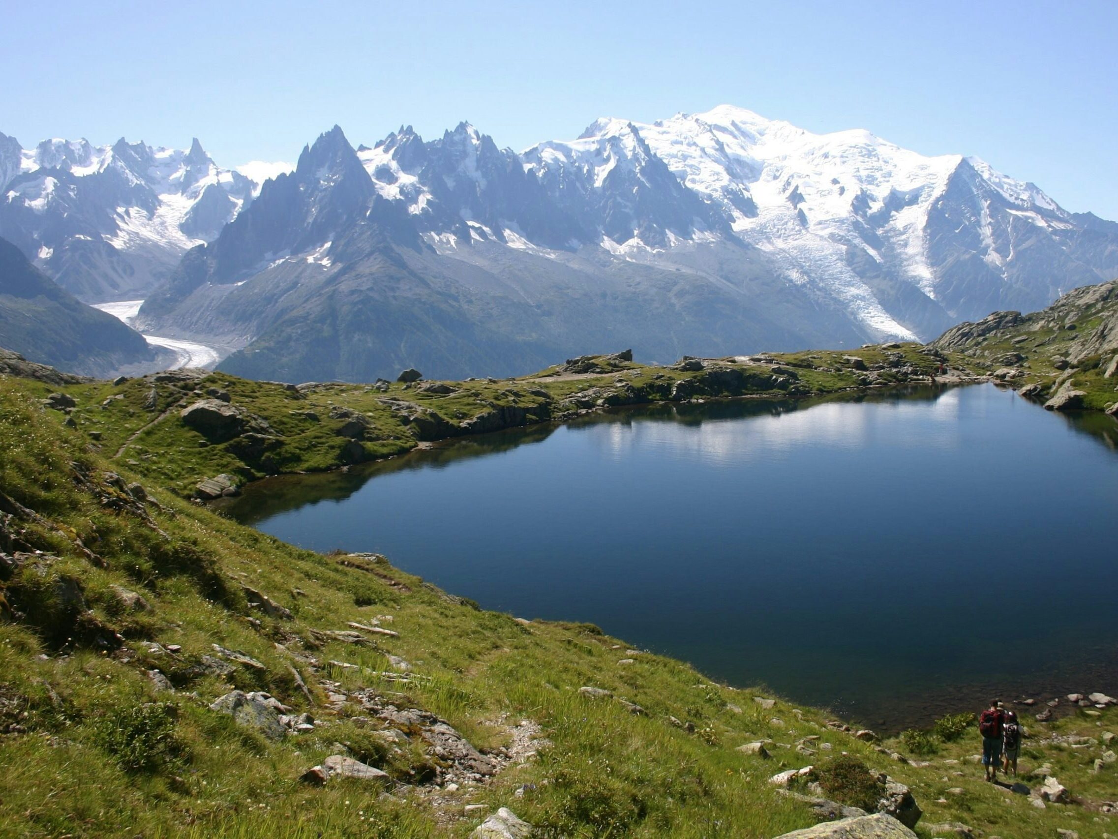 hiking scenic trails with group and guide in hiking circuit trail of Tour du Mont Blanc in the summer