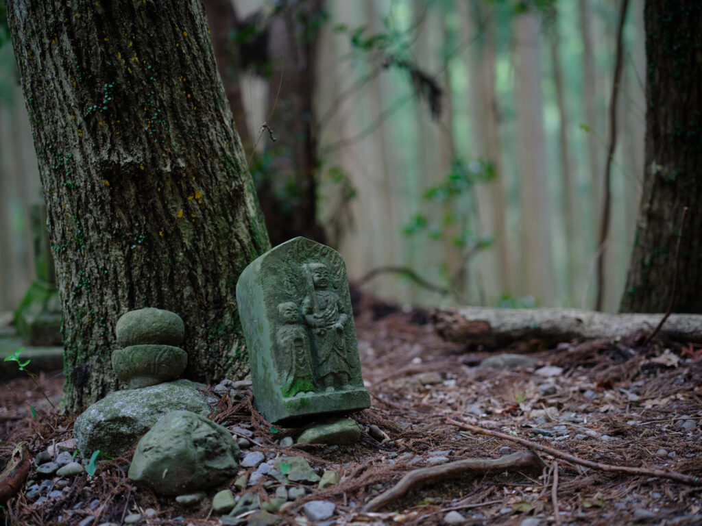old stone statues in Kumano Kodo ancient trail in Japan