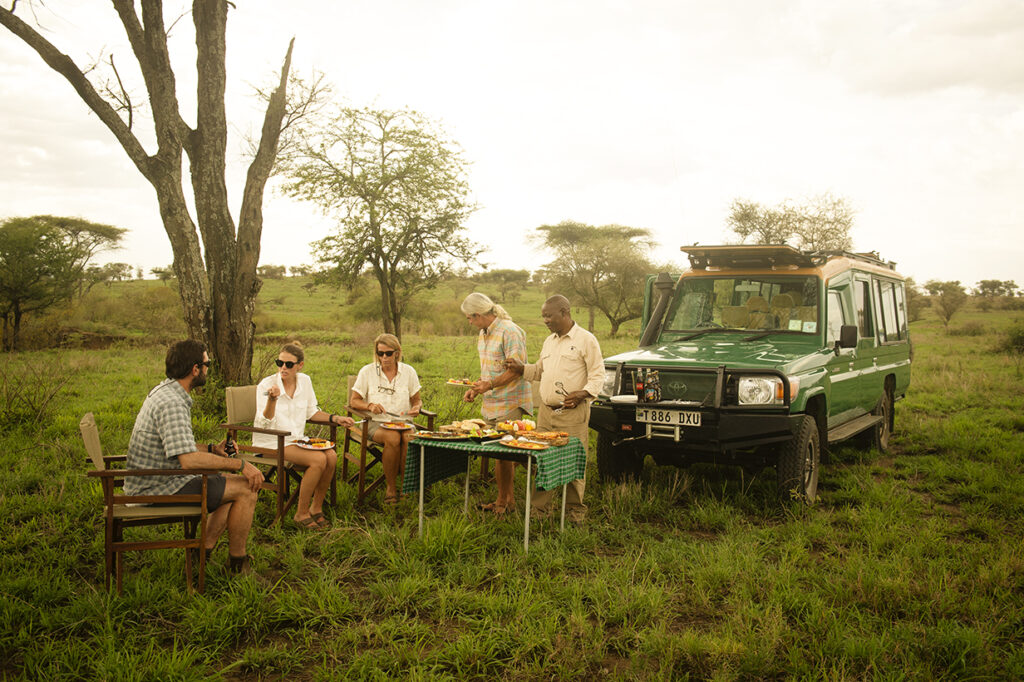 guides providing meals in tanzania safari